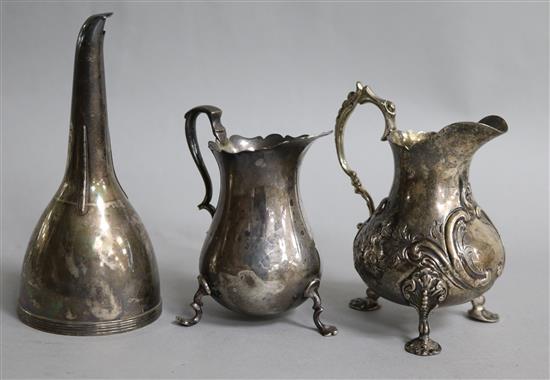 A Georgian silver wine funnel (no strainer) and two silver cream jugs, 8.8 oz.